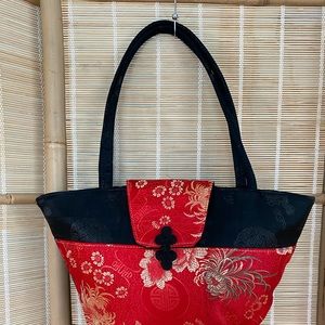 Oriental inspired brocade closure silky handbag